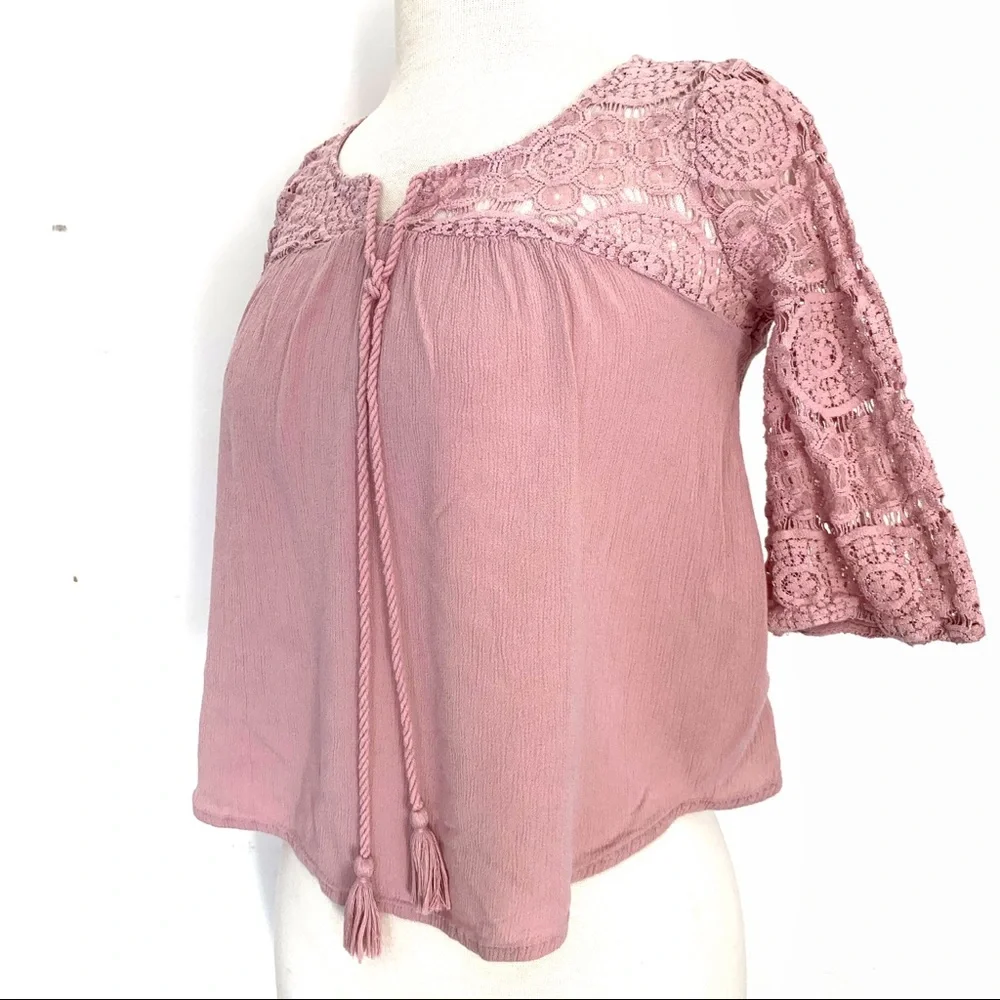Super cute woman’s pink lace angel sleeve top